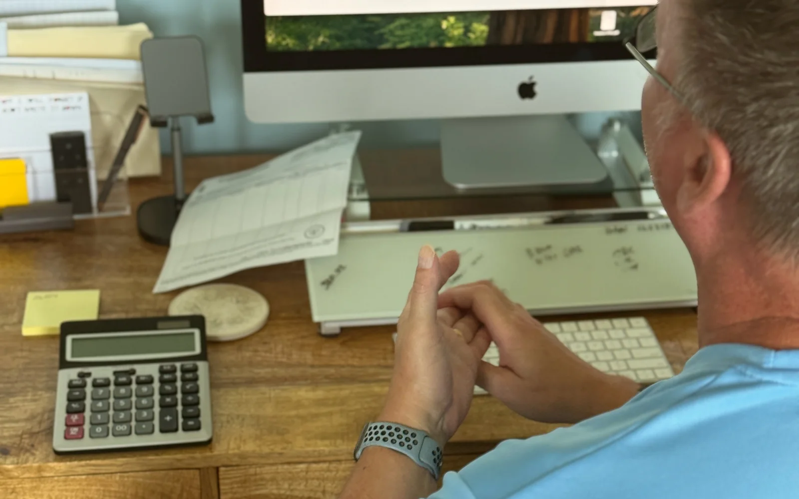 Contractor reviewing digital marketing and search strategy at a desktop computer
