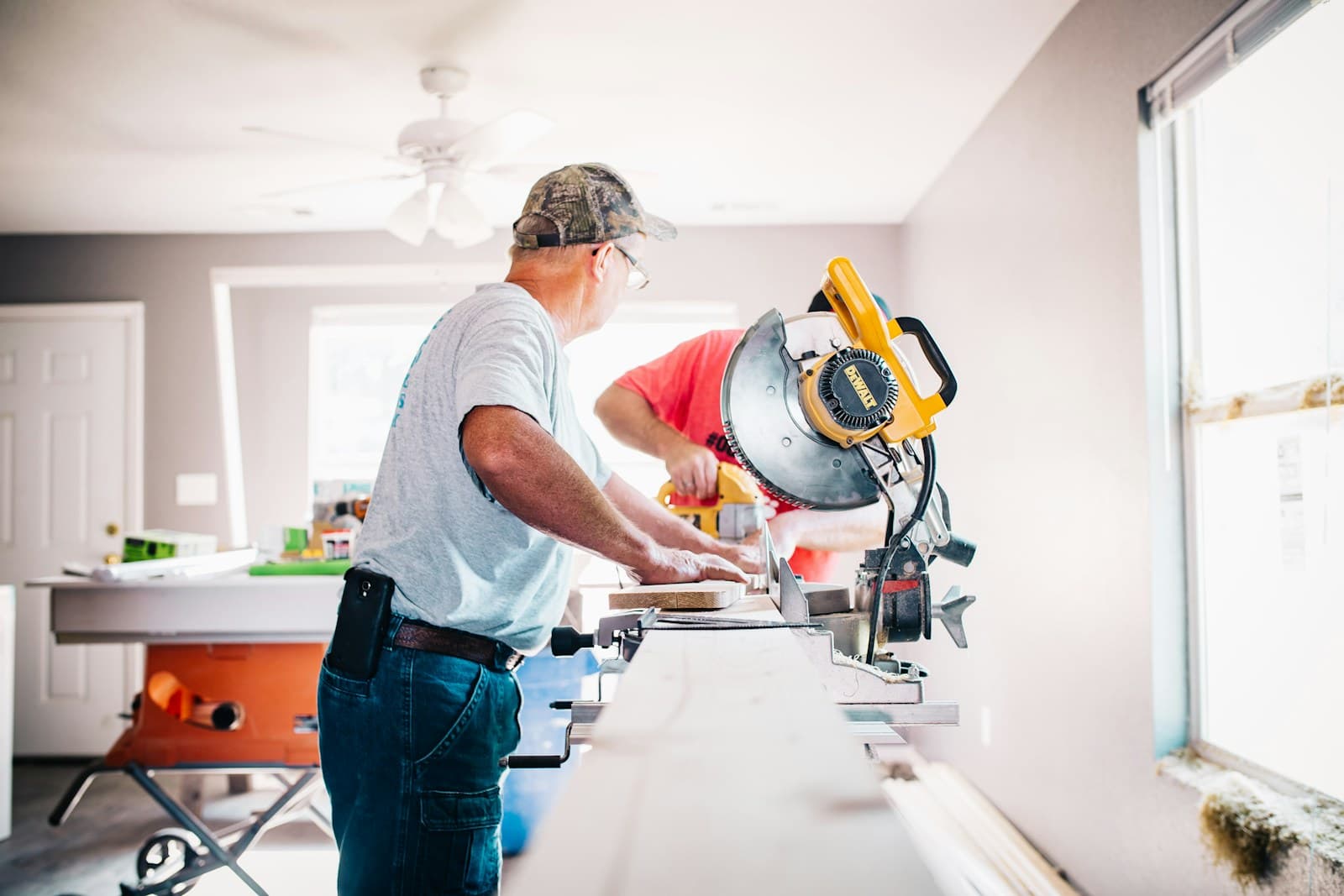 Remodeling contractor using a miter saw for a Kansas City remodeling lead generation guide
