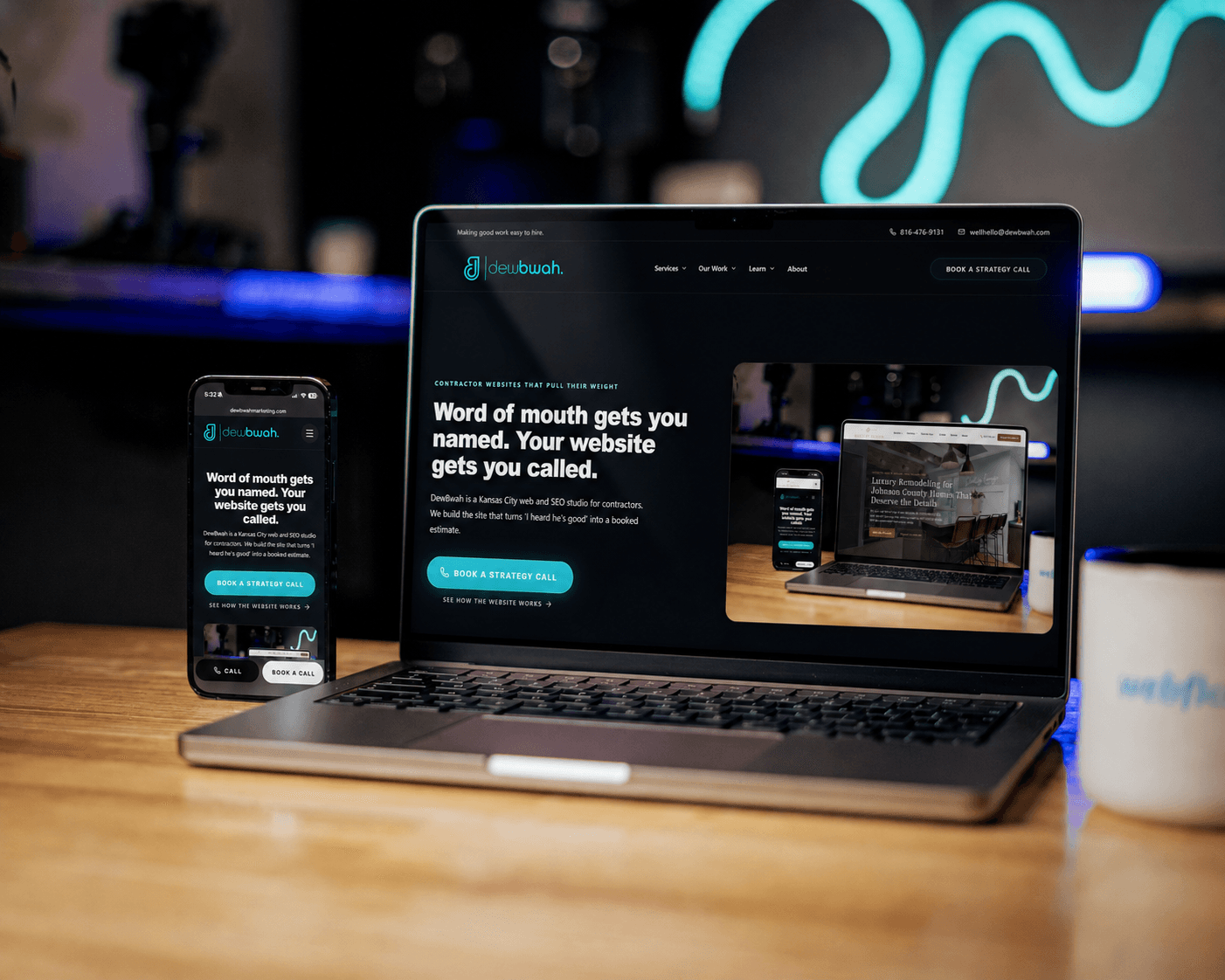 DewBwah Marketing website displayed on a laptop and phone