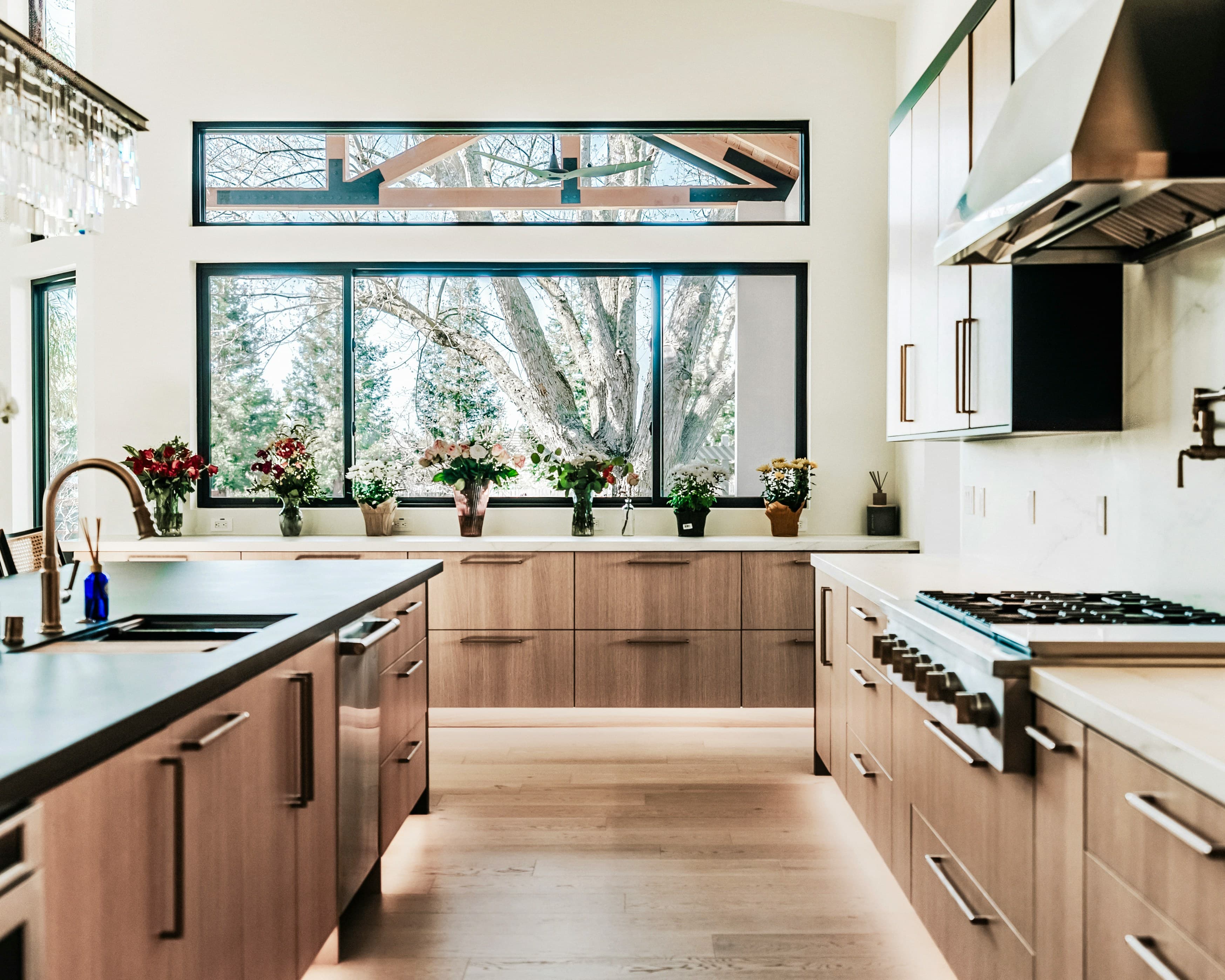 Remodeled South Kansas City kitchen with large windows and custom cabinetry