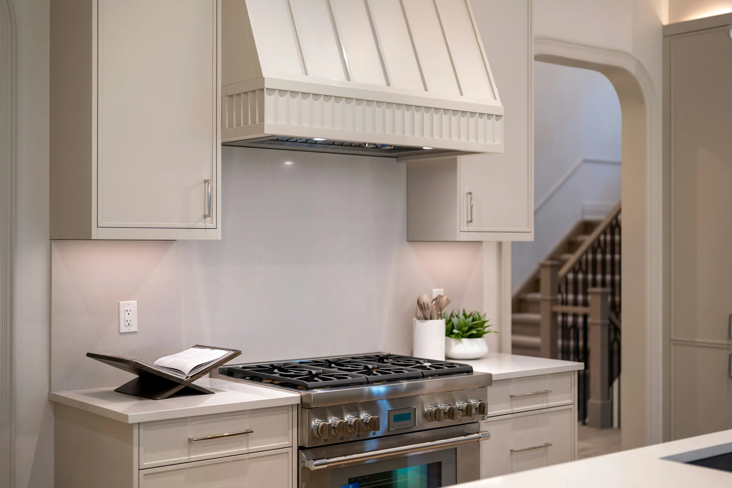 Custom kitchen range hood with subtle fluted trim